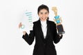 Successful young Asian business woman celebrating with trophy award over white isolated background. Success achievement in Royalty Free Stock Photo