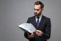 Successful young business man in classic black suit shirt tie posing isolated on grey background. Achievement career Royalty Free Stock Photo