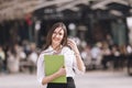 Successful young business smiling woman speaking on the phone outdoor.