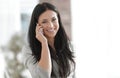 Successful young business woman talking on a smartphone. Royalty Free Stock Photo