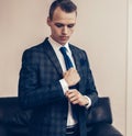 Young businessman adjusting his cufflinks. business concept Royalty Free Stock Photo
