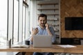 Successful young businessman multitasking in modern office room. Royalty Free Stock Photo