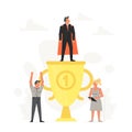 Successful and young businessman on podium. Little man standing on large gold trophy. People are happy for winner Royalty Free Stock Photo