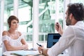 Successful young businesswoman getting financial advise from business consultant