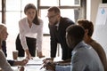 Successful young female team leader listening to coworkers ideas. Royalty Free Stock Photo