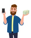 Successful young man showing or holding a mobile, cell, smart phone and bunch of cash, money, dollar, currency, bank notes in hand Royalty Free Stock Photo