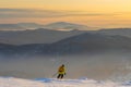 Successful young man skiing in the mountains Sheregesh. Skier resting on mountain top. Caucasian Skier on a background of sky . Royalty Free Stock Photo