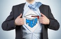 Successful young student is tearing the shirt. Business education icons are drawn on the chest. Royalty Free Stock Photo