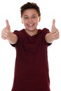 Successful young teenager boy showing thumbs up Royalty Free Stock Photo