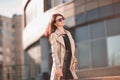 Successful young woman standing on the street near the office building Royalty Free Stock Photo