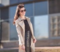 Successful young woman standing on the street near the office building Royalty Free Stock Photo