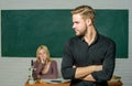 Successfully graduated. Youth mentoring. Man well groomed attractive teacher in front of classroom. Obsessed with Royalty Free Stock Photo