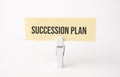 SUCCESSION PLAN text on paper. On white background Royalty Free Stock Photo