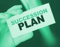 Succession Plan words on a card in hand of businessman. Business profit and success concept Royalty Free Stock Photo