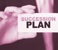 Succession Plan words on a card in hand of businessman. Business profit and success concept Royalty Free Stock Photo