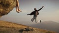 Succsses. Man hipster jumping on mountain on blue sky Royalty Free Stock Photo