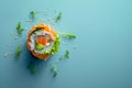 Succulent, bright and vibrant salmon sushi roll, with sushi rice and rocket salad on a light blue background with space for copy Royalty Free Stock Photo