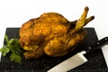 Roast chicken and coriander on chopping board