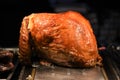 Succulent golden whole roast turkey joint of meat resting and ready to carve