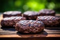 Succulent grilled beef burger patty with melted cheese and fresh toppings on a rustic wooden board