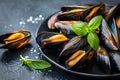 Succulent grilled mussels on stylish black plate traditional mediterranean seafood delicacy