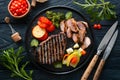 Succulent grilled steak, pork, and veggies plated for gourmet dining