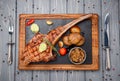 Succulent grilled tomahawk beef steak on the bone Royalty Free Stock Photo