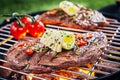 Succulent piece of rump steak grilling on a BBQ