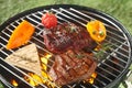 Succulent tender rump steak grilling on a barbecue