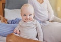 Such a cutie pie. Cropped portrait of a baby girl and her parents in the bedroom. Royalty Free Stock Photo