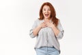 Such pleasant surprise darling. Amused excited middle-aged lucky optimistic redhead woman smiling broadly hands chest Royalty Free Stock Photo