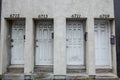 Entrance doors of four housing flats, small units, with their following street numbers, in the center of Montreal, Quebec, Canada.