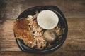Lechona with rice, arepa and potato