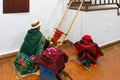 Sucre Bolivia woman works wool on an ancient loom at the textile museum Royalty Free Stock Photo