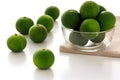 Sudachi; green small Japanese citrus in a bowl Royalty Free Stock Photo
