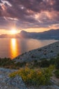 Sudak, Crimea - a view from Cape Meganom. Sunset sky with beautiful clouds. The Black Sea and the ridge of the Crimean mountains. Royalty Free Stock Photo