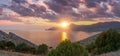 Sudak, Crimea - a view from Cape Meganom. Sunset sky with beautiful clouds. The Black Sea and the ridge of the Crimean mountains. Royalty Free Stock Photo