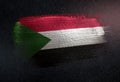 Sudan Flag Made of Metallic Brush Paint on Grunge Dark Wall