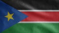 Sudanese flag waving in the wind. Close up South Sudan banner blowing soft silk