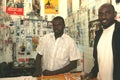 A Sudanese refugee in his mobile phone shop