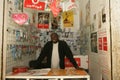 A Sudanese refugee in his mobile phone shop Royalty Free Stock Photo