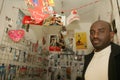 A Sudanese refugee in his mobile phone shop