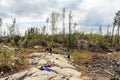 SUDBURY, ONTARIO, CANADA - MAY 23 2009: Group of workers and geologists standing and working on geological outcrop site.