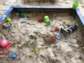 Suddenly abandoned forgotten children's toys in the sandbox