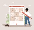 Sudoku game. African woman with giant pencil solves crossword puzzle. Learning and leisure concept. Task for development Royalty Free Stock Photo