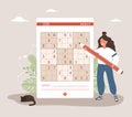 Sudoku game. Woman with giant pencil solves crossword puzzle. Learning and leisure concept. Task for development of Royalty Free Stock Photo