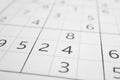 Sudoku puzzle grid as background, closeup view