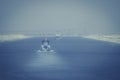 In the Suez Canal - a military ship and a tugboat forward to the