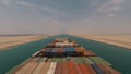 Suez, Egypt - huge container vessel proceeding through the Suez Canal. Time laps