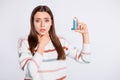 Suffering of bronchospasm lady going to inhale medication wear striped pullover isolated white background